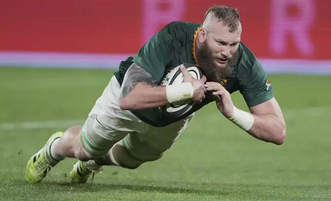 South Africa RG Snyman scores a try their Rugby Championship test match against New Zealand in Wellington, New Zealand, Saturday, Sept. 13, 2025. (AP Photo/Marty Melville)