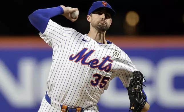New York Mets pitcher Clay Holmes throws during the second inning of a baseball game against the San Diego Padres, Tuesday, Sept. 16, 2025, in New York. (AP Photo/Adam Hunger)