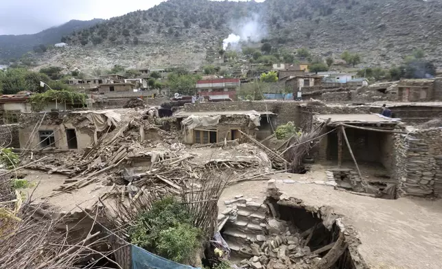 Collapsed houses are seen in an area devastated by Sunday's powerful 6.0-magnitude earthquake that killed many people and destroyed villages in eastern Afghanistan, in Dara Noor, Kunar province, Tuesday, Sept. 2, 2025,. (AP Photo/Wahidullah Kakar)