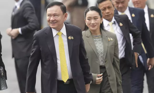 CORRECTS NAME OF DAUGHTER - Thailand's former Prime Minister Thaksin Shinawatra, left, and his daughter and former Prime Minister Paetongtarn Shinawatra, right, arrive at Supreme Court in Bangkok, Thailand, Tuesday, Sept. 9, 2025. (AP Photo/Sakchai Lalit)