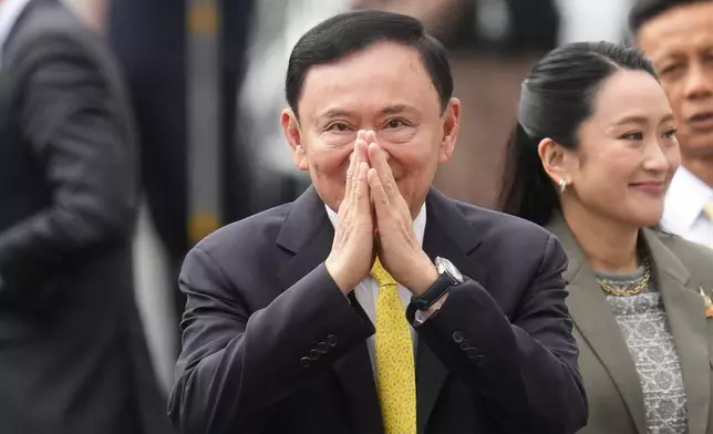 CORRECTS NAME OF DAUGHTER - Thailand's former Prime Minister Thaksin Shinawatra, center, and his daughter and former Prime Minister Paetongtarn Shinawatra, right, arrive at Supreme Court in Bangkok, Thailand, Tuesday, Sept. 9, 2025. (AP Photo/Sakchai Lalit)