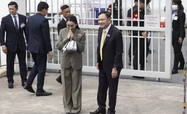 CORRECTS NAME OF DAUGHTER - Thailand’s former Prime Minister Thaksin Shinawatra, center right, and his daughter and former Prime Minister Paetongtarn Shinawatra, center left, arrive at Supreme Court in Bangkok, Thailand, Tuesday, Sept. 9, 2025.(AP Photo/Wason Wanitchakorn)