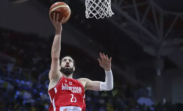 Georgia's Tornike Shengelia goes for the basket during the Eurobasket, European Basketball Championship Group C match between Greece and Bosnia at Spyros Kyprianou Arena, in Limassol, Cyprus, Tuesday, Sept. 2, 2025. (AP Photo/Chara Savvidou)