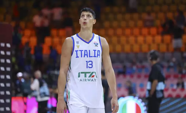 Italy's Simone Fontecchio reacts after his team won Spain at the end of the Eurobasket, European Basketball Championship Group C match between Spain and Italy at Spyros Kyprianou Arena, in Limassol, Cyprus, Tuesday, Sept. 2, 2025. (AP Photo/Chara Savvidou)