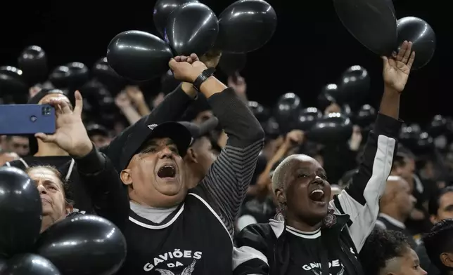 FILE - Fans cheer on Brazil's Corinthians during a Copa Sudamericana Group F soccer match against Argentina's Argentinos Juniors at Neo Quimica Arena in Sao Paulo, Brazil, May 14, 2024. (AP Photo/Andre Penner, File)