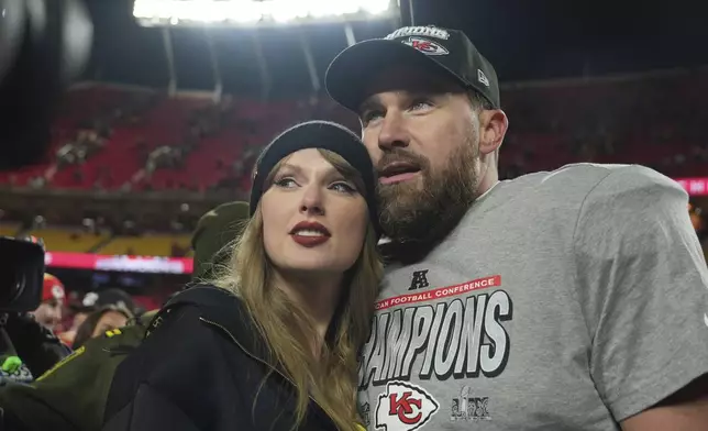FILE - Kansas City Chiefs tight end Travis Kelce, right, is congratulated by Taylor Swift as they celebrate the Chiefs victory over the Buffalo Bills in the AFC Championship NFL football game, Jan. 26, 2025, in Kansas City, Mo. (AP Photo/Charlie Riedel, File)
