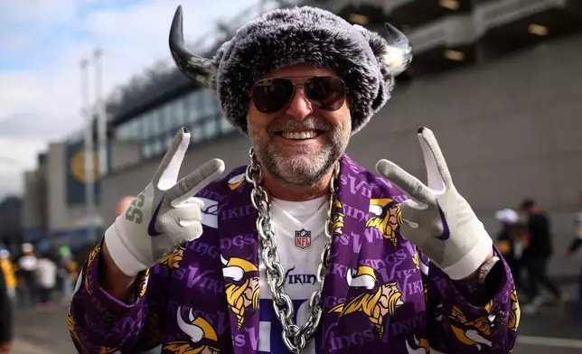 A supporter poses for photographers before the start of the NFL football game between Minnesota Vikings and Pittsburgh Steelers at Croke Park stadium in Dublin, Sunday, Sept. 28, 2025.(AP Photo/Peter Morrison)