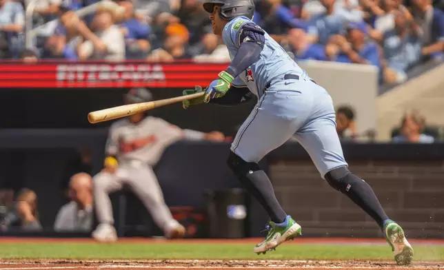 Toronto Blue Jays' George Springer watches his RBI double during third-inning baseball game action against the Baltimore Orioles in Toronto, Sunday, Sept. 14, 2025. (Chris Young/The Canadian Press via AP)