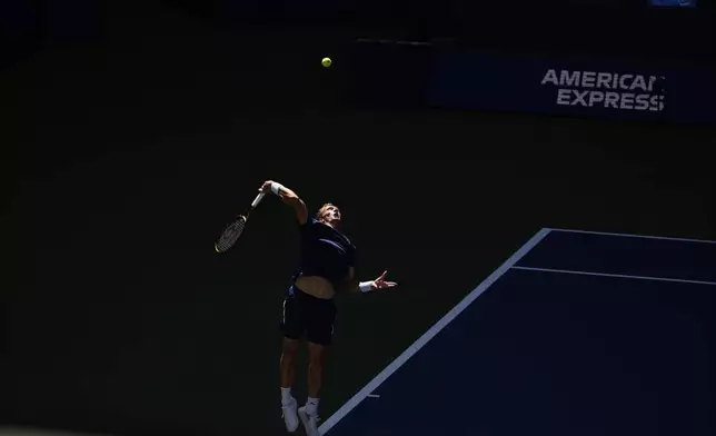 Jiri Lehecka, of the Czech Republic, serves against Adrian Mannarino, of France, during the fourth round of the U.S. Open tennis championships, Sunday, Aug. 31, 2025, in New York. (AP Photo/Pamela Smith)