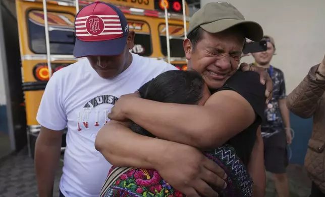Edwin Osorio López, right, embraces his mother María Cristina López after being deported from the United States, outside La Aurora International Airport, in Guatemala City, Sunday, Aug. 31, 2025. (AP Photo/Moises Castillo)