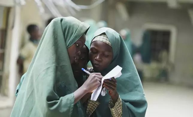 Students of the Future Prowess Islamic Foundation School study during break time, in Maiduguri, Nigeria, Thursday, July 24, 2025. (AP Photo/Sunday Alamba)