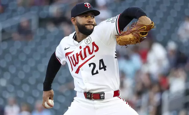 CORRECTS TO TWINS PITCHER SIMEON WOODS RICHARDSON NOT YANKEES PITCHER CARLOS RODON - Minnesota Twins pitcher Simeon Woods Richardson delivers against the New York Yankees during the first inning of baseball game Monday, Sept. 15, 2025, in Minneapolis. (AP Photo/Matt Krohn) Simeon Woods Richardson