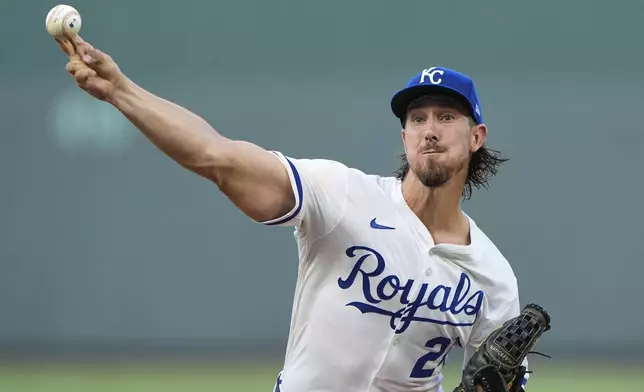 Kansas City Royals starting pitcher Michael Lorenzen throws during the first inning of a baseball game against the Los Angeles Angels, Tuesday, Sept. 2, 2025, in Kansas City, Mo. (AP Photo/Charlie Riedel)