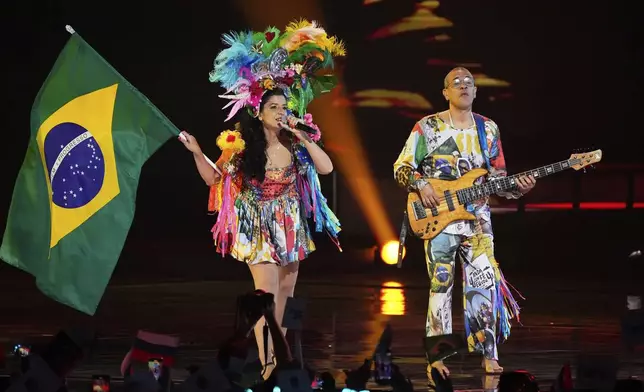 Brazil's Family Duo Luciano Calazans &amp; Thais Nader perform the song "Popcorn With Love" at the International Music Competition "Intervision" at the Live Arena outside Moscow, Russia, Saturday, Sept. 20, 2025. (AP Photo/Alexander Zemlianichenko)