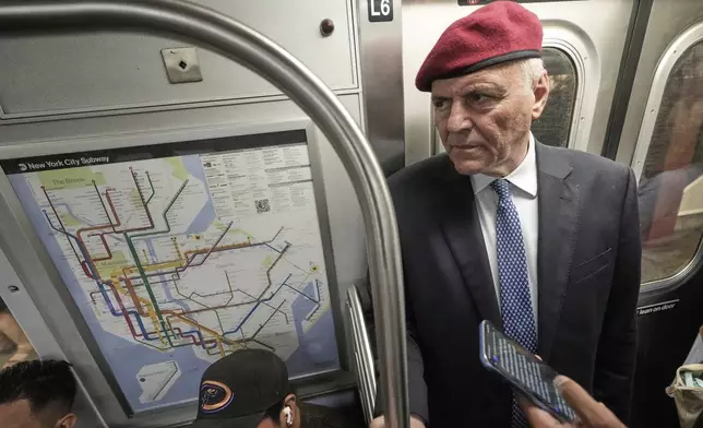 New York Mayor candidate Curtis Sliwa rides the subway as he campaigns in the New York City system, Monday, Aug. 18, 2025. (AP Photo/Richard Drew)