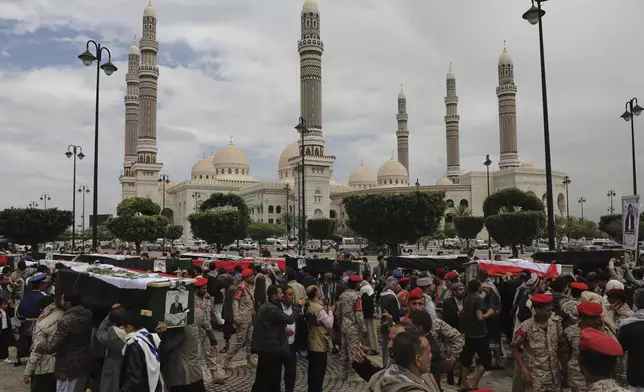 Yemenis cary the coffins of 31 local journalists reportedly killed in Israeli airstrikes last week, during their funeral in Sanaa, Yemen, Tuesday, Sept. 16, 2025. (AP Photo/Osamah Abdulrahman)