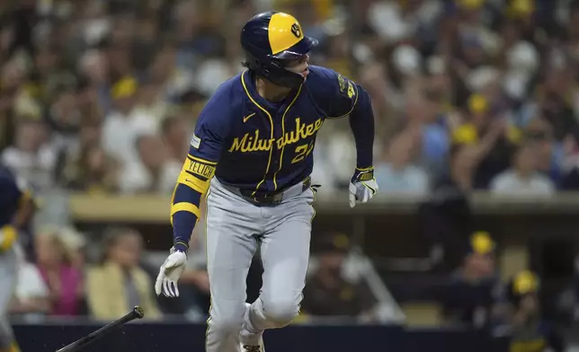 Milwaukee Brewers' Christian Yelich watches his two-RBI single during the second inning of a baseball game against the San Diego Padres Monday, Sept. 22, 2025, in San Diego. (AP Photo/Gregory Bull)