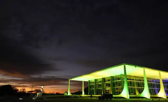 Dawn breaks at the Supreme Court headquarters where the trial of former President Jair Bolsonaro begins in the case for allegedly leading a conspiracy to stay in power, in Brasilia, Brazil, Tuesday, Sept. 2, 2025. (AP Photo/Eraldo Peres)