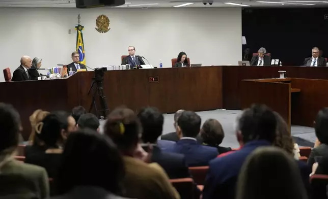 The Brazilian Supreme Court holds the verdict and sentencing phase of a trial for those charged in an alleged coup plot to keep former President Jair Bolsonaro in office after his 2022 election defeat, in Brasilia, Brazil, Tuesday, Sept. 2, 2025. (AP Photo/Eraldo Peres)