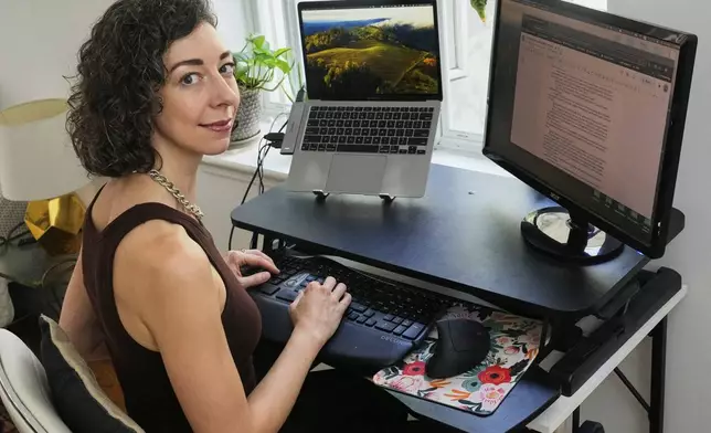 Thriller novelist Andrea Bartz is photographed in her home, in the Brooklyn borough of New York, Thursday, Sept. 4, 2025 (AP Photo/Richard Drew)