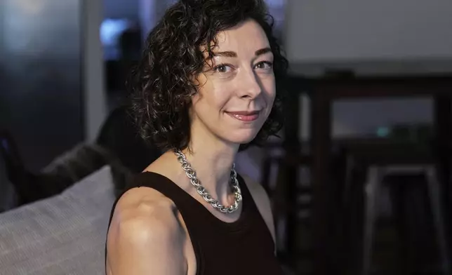 Thriller novelist Andrea Bartz is photographed in her home, in the Brooklyn borough of New York, Thursday, Sept. 4, 2025 (AP Photo/Richard Drew)