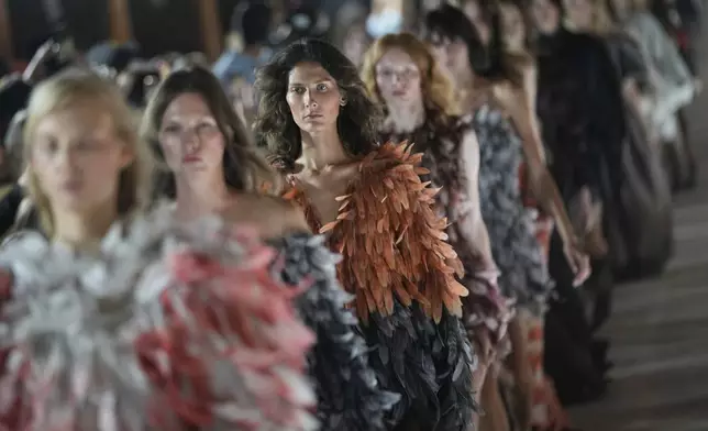 Model wear creations by Russian designer Alena Akhmadullina on a runway at Moscow Fashion Week in Moscow, Tuesday, Sept. 2, 2025. (AP Photo/Pavel Bednyakov)