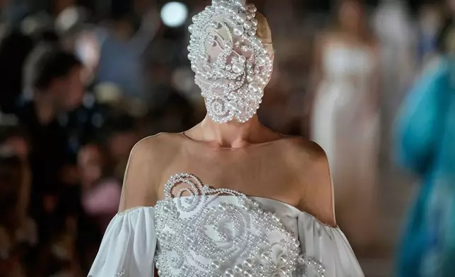 A model wears a creation by Russian designer Alena Akhmadullina on a runway at Moscow Fashion Week in Moscow, Tuesday, Sept. 2, 2025. (AP Photo/Pavel Bednyakov)