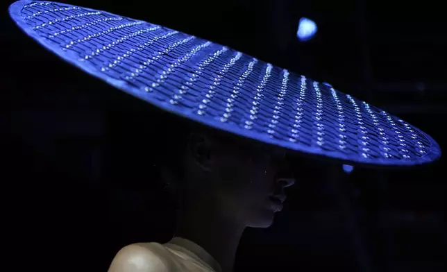 A model wears a creation by Brazilian brand Artemisi on a runway at the Moscow Fashion Week in Moscow, Russia, Friday, Aug. 29, 2025. (AP Photo/Pavel Bednyakov)