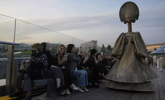 A model wears a creation by Russian brand Mandragora on a runway at the Moscow Fashion Week on the Floating Bridge at Zaryadye park in Moscow, Russia, Friday, Aug. 29, 2025. (AP Photo/Pavel Bednyakov)