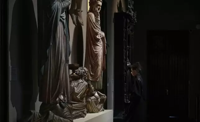 A model is prepared for a runway show by Russian brand Soroka On Course at the Pushkin State Museum of Fine Arts during the Moscow Fashion Week in Moscow, Russia, Monday, Sept. 1, 2025. (AP Photo/Pavel Bednyakov)