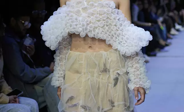 A model wears a creation by Russian designer Tatiana Kotova on a runway at Moscow Fashion Week in Moscow, Russia, Thursday, Aug. 28, 2025. (AP Photo/Pavel Bednyakov)