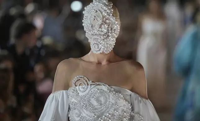 A model wears a creation by Russian designer Alena Akhmadullina on a runway at Moscow Fashion Week in Moscow, Tuesday, Sept. 2, 2025. (AP Photo/Pavel Bednyakov)