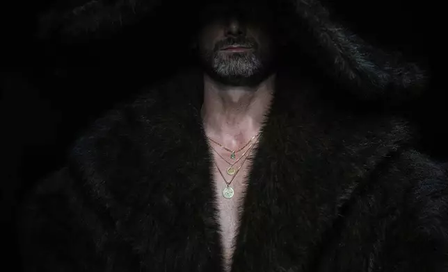 A model wears a creation by Russian brand INNIKI on a runway at the Moscow Fashion Week in Moscow, Russia, Friday, Aug. 29, 2025. (AP Photo/Pavel Bednyakov)