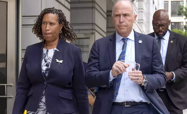 FILE - District of Columbia Mayor Muriel Bowser, left, and District of Columbia Attorney General Brian Schwalb walk out of federal court in Washington, Friday, Aug. 15, 2025. (AP Photo/Mark Schiefelbein, FIle)