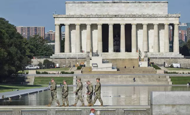 National Guard troops patrol the Mall near the Lincoln Memorial as part of President Donald Trump's order to impose federal law enforcement in the nation's capital, in Washington, Thursday, Aug. 28, 2025. (AP Photo/J. Scott Applewhite)