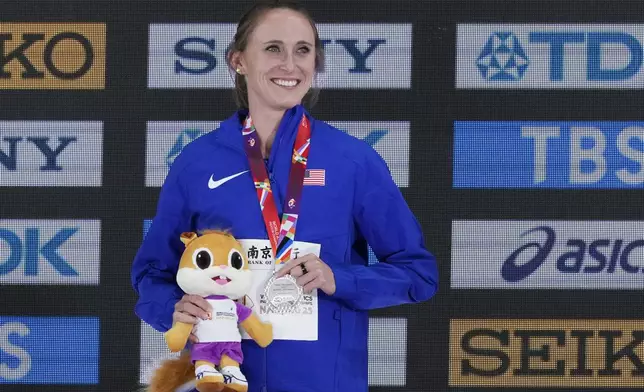 FILE - Shelby Houlihan, of the United States, poses on the podium after winning the silver medal in the women's 3000 meters at the World Athletics Indoor Championships in Nanjing, China, Saturday, March 22, 2025. (AP Photo/Dar Yasin, File)