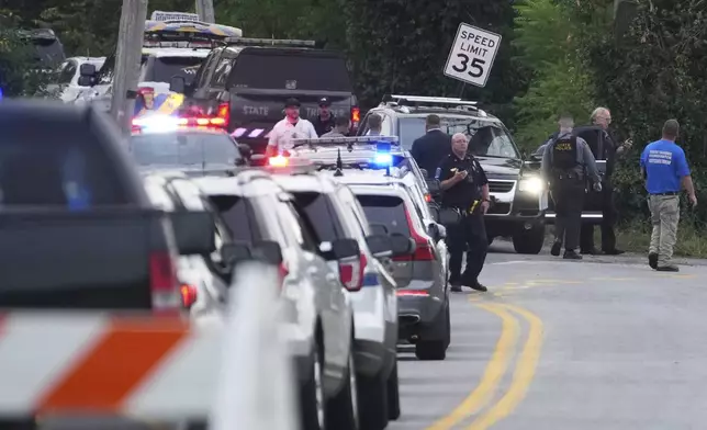 First responders work the scene after several people were injured during a shooting involving police officers on Wednesday, Sept. 17, 2025, in North Codorus, Pa. (AP Photo/Matt Slocum)