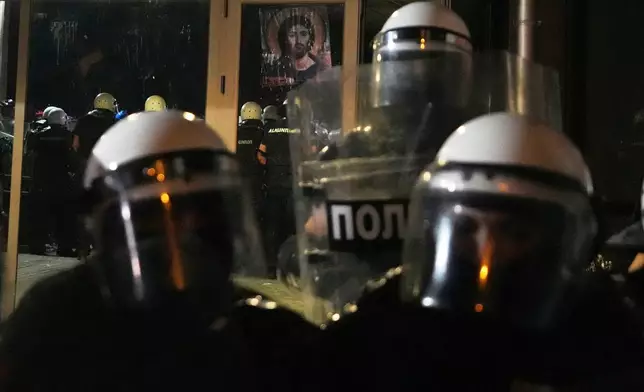 Serbian riot police guard Faculty of Philosophy during a protest against increasing police brutality in the northern Serbian city of Novi Sad, Friday, Sept. 5, 2025. (AP Photo/Darko Vojinovic)