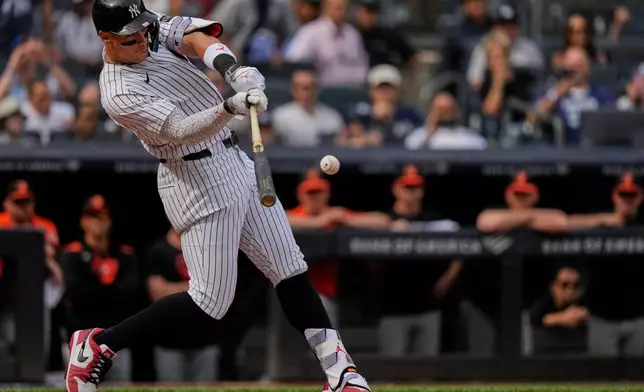 New York Yankees' Aaron Judge hits a two-run single during the fifth inning of a baseball game against the Baltimore Orioles Saturday, Sept. 27, 2025, in New York. (AP Photo/Frank Franklin II)
