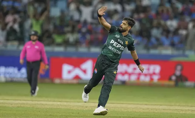 Pakistan's Haris Rauf celebrates the wicket of India's Sanju Samson during the Asia Cup cricket match between India and Pakistan at Dubai International Cricket Stadium, United Arab Emirates, Sunday, Sept. 21, 2025. (AP Photo/Altaf Qadri)