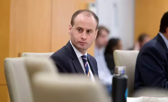 National Capital Planning Commission Chairman Will Scharf presides over a National Capital Planning Commission meeting, Thursday, Sept. 4, 2025, in Washington. (AP Photo/Rod Lamkey, Jr.)