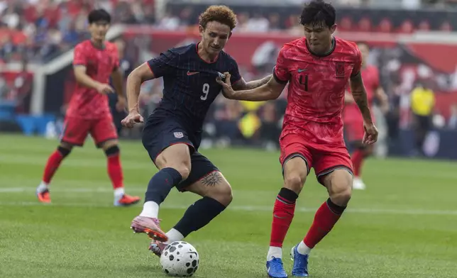 United States' Josh Sargent, left, battles for the ball against South Korea's Kim Min-jae, right, during a friendly soccer match at Sport Illustrator Stadium on Saturday, Sept. 6, 2025, in Harrison, N.J. (AP Photo/Andres Kudacki)