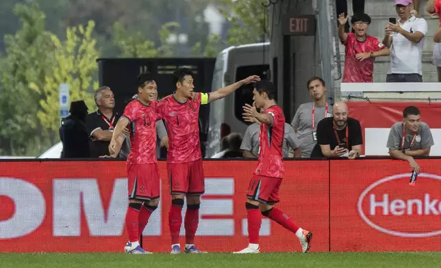 South Korea's Son Heung-min, center, celebrates his goal with team mates during a friendly soccer match against United States on Saturday, Sept. 6, 2025, in Harrison, N.J. (AP Photo/Andres Kudacki)