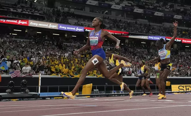United States' Melissa Jefferson-Wooden wins the women's 100 meters final at the World Athletics Championships in Tokyo, Sunday, Sept. 14, 2025. (AP Photo/David J. Phillip)
