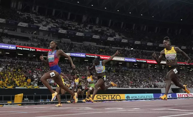 United States' Melissa Jefferson-Wooden wins the women's 100 meters final at the World Athletics Championships in Tokyo, Sunday, Sept. 14, 2025. (AP Photo/David J. Phillip)