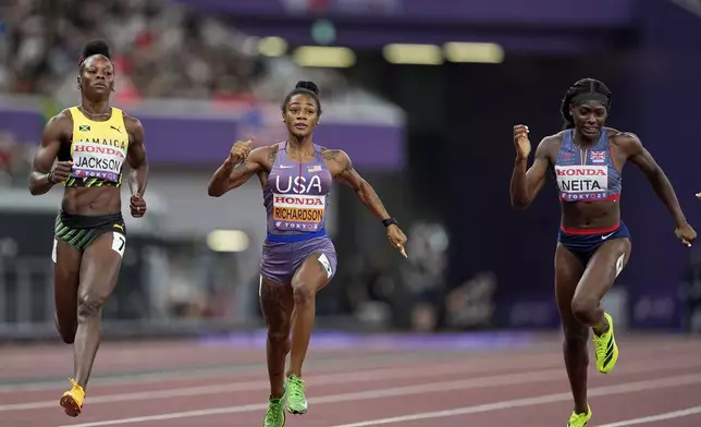 United States' Sha'Carri Richardson, Britain's Daryll Neita and Jamaica's Shericka Jackson compete in a women's 100 meters semifinal at the World Athletics Championships in Tokyo, Sunday, Sept. 14, 2025. (AP Photo/Petr David Josek)