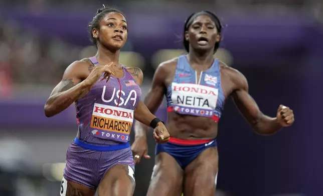 United States' Sha'Carri Richardson and Britain's Daryll Neita finish a women's 100 meters semifinal at the World Athletics Championships in Tokyo, Sunday, Sept. 14, 2025. (AP Photo/Petr David Josek)
