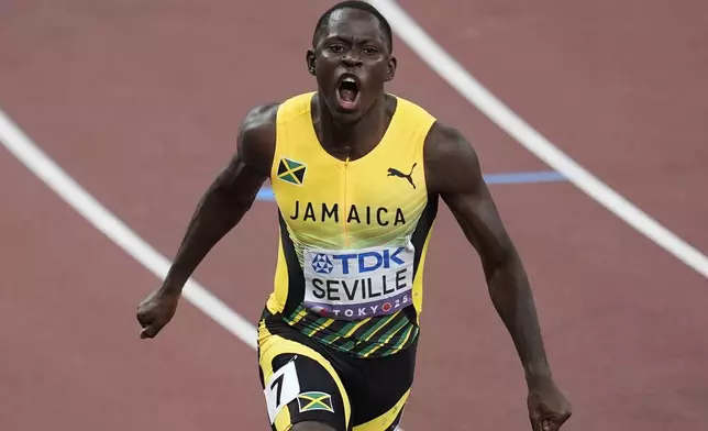 Jamaica's Oblique Seville reacts after winning the men's 100 meters final at the World Athletics Championships in Tokyo, Sunday, Sept. 14, 2025. (AP Photo/Abbie Parr)