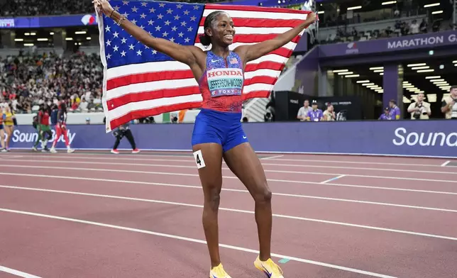 United States' Melissa Jefferson-Wooden reacts after winning the women's 100 meters final at the World Athletics Championships in Tokyo, Sunday, Sept. 14, 2025. (AP Photo/Ashley Landis)