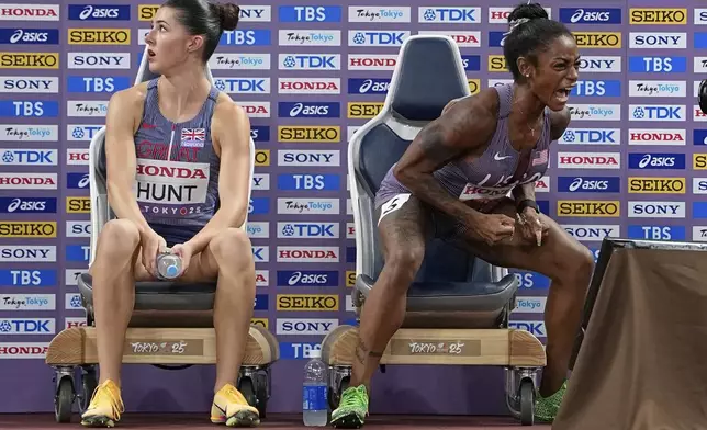 United States' Sha'Carri Richardson celebrates after qualifying for the women's 100 meters final as Britain's Amy Hunt reacts at the World Athletics Championships in Tokyo, Sunday, Sept. 14, 2025. (AP Photo/Ashley Landis)